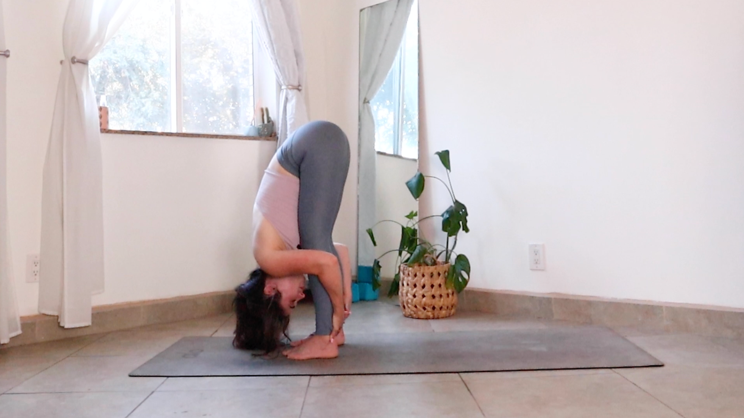 Teacher Daria LeGrand in Standing Forward Bend